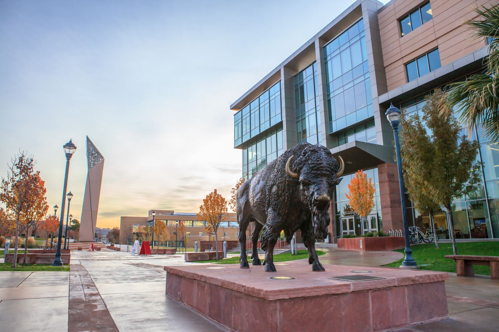Utah Tech pictured behind a statue of the school's mascot, Brooks the Bison.